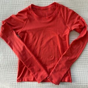 lululemon athletica orange colored waist length swiftly tech longsleeve